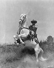 photo of clayton moore as the lone ranger atop his horse silver