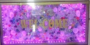 Image of welcome mat made with pink glitter