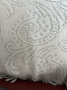 Photo of a section of a white lace Cashmere blanket