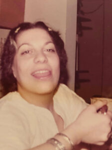 Photo of 20-something Karen enjoying coffee in her first apartment.